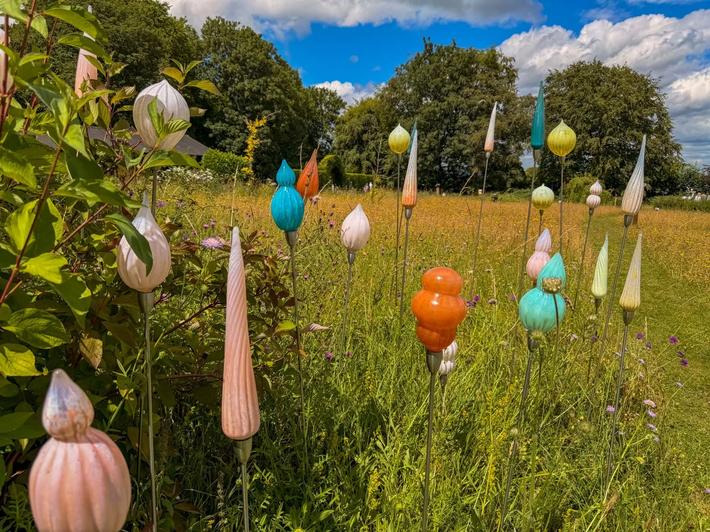 Colourful glass sculptures on display in the Glass Barn at High Clandon
