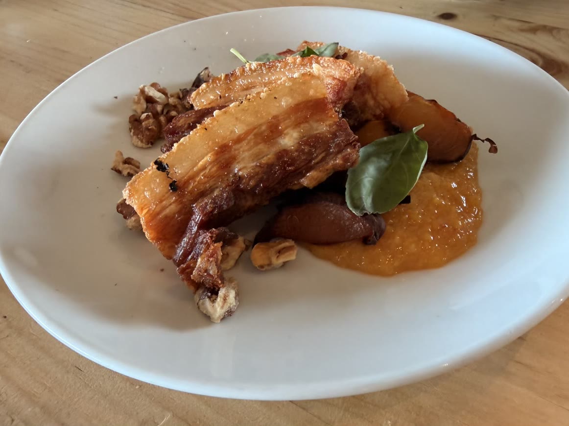 Pork belly with charred peach purée, walnuts and basil at Kinsbrook's restaurant